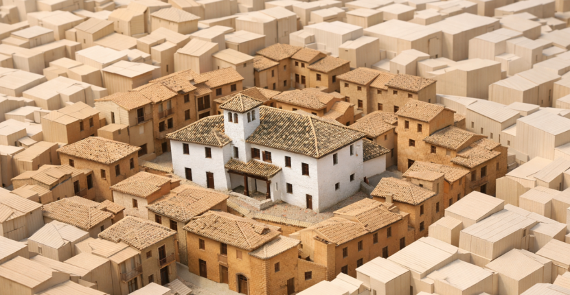 Maqueta arquitectónica que representa un Bien de Interés Cultural (BIC) y la delimitación de su entorno de protección en un casco histórico.